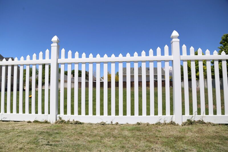 White vinyl scalloped picket fence panel