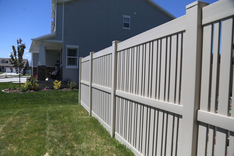 Tan vinyl semi-privacy fence